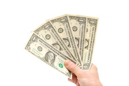 Hand holding one-dollar banknotes