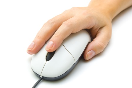 Hand holding PC mouseの写真素材