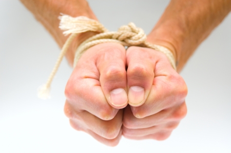 Tied male handsの写真素材