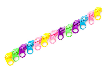 Multicolored zippers on white backgroundの写真素材