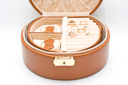 Casket with jewelry on white background