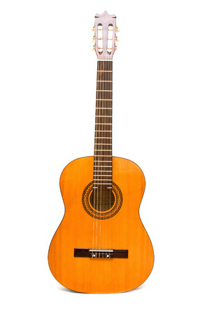 Classic acoustic guitar isolated on whiteの写真素材