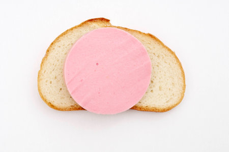 Slice sausage on bread closeup