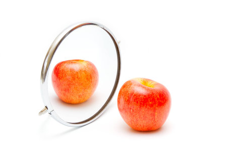 Apple,reflecting in mirrorの写真素材