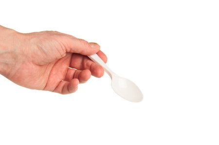Plastic spoon in handの写真素材