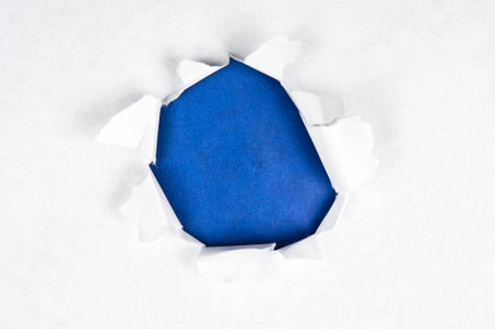 Torn paper with blue spaceの写真素材