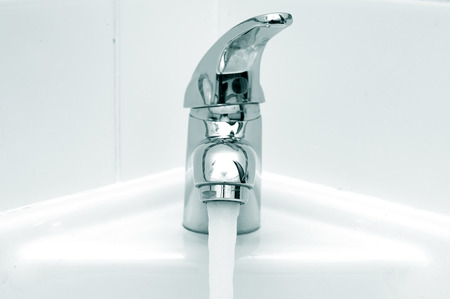 Flowing water from faucetの写真素材