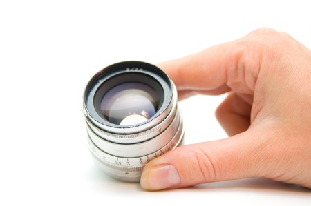 Old lens in handの写真素材