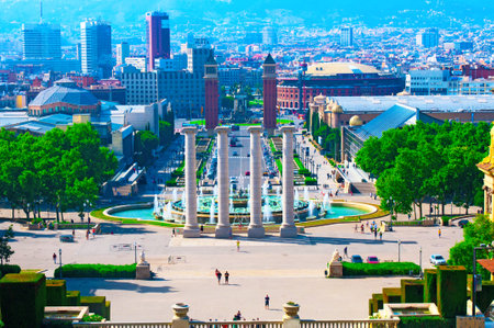 BARCELONA,SPAIN - JUN 10, 2014:  View on Magic Fountain and Placa De Espanya with the two venetians towers at the entrance. のeditorial素材