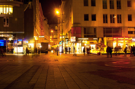 Tourists and locals walking at Stephansplatz of Vienna, Austria in night. Stephansplatz is the most popular square in the cityのeditorial素材