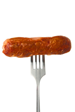 Grilled sausage on a forkの写真素材