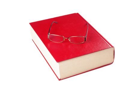 Dictionary and eyeglasses on white backgroundの写真素材