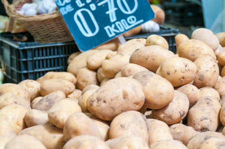 Organic potatoes on a market stallの写真素材