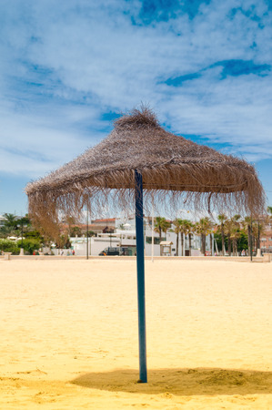 Reed umbrella on the beachの写真素材