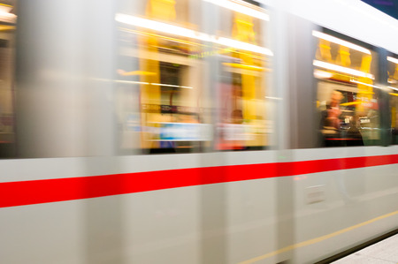 Moving subway train at Schwedenplatz stationの写真素材