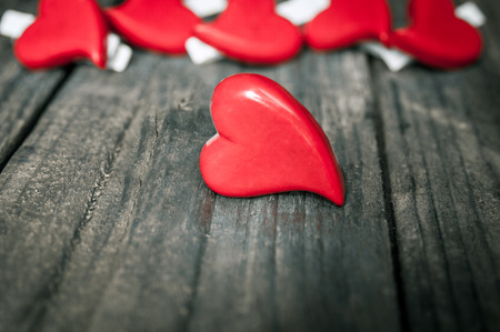 Hearts on wooden background. Valentines Day greeting card.の写真素材