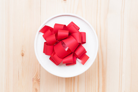 Round gift box on wooden backgroundの写真素材