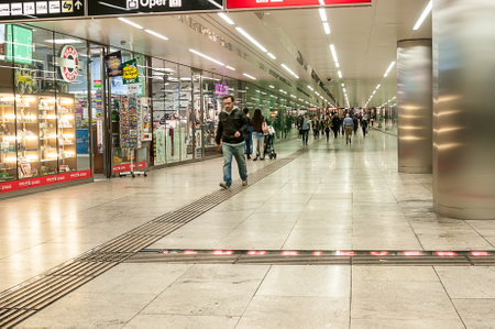 People waking in tunnel underground metro at Karlsplatz station in Vienna, Austriaのeditorial素材
