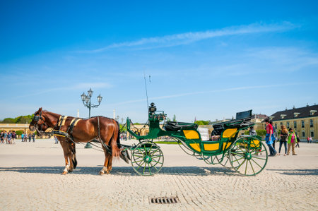 VIENNA, AUSTRIA - APRIL 23, 2016: Old-fashioned fiacre in Schonbrunn Palaceのeditorial素材