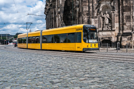 DRESDEN, GERMANY- JUNE 20, 2016:  Yellow articulated tram SachsenTram  at the city streetのeditorial素材