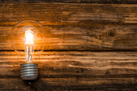Light bulb on wooden backgroundの写真素材