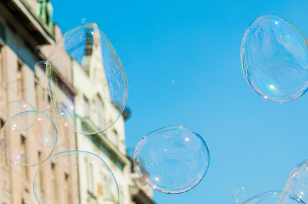 Soap bubbles on blue sky backgroundの写真素材