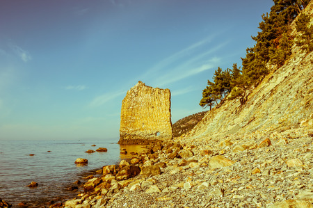 Rock and sea. Retro toned imageの写真素材
