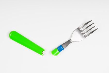 Broken fork on white background