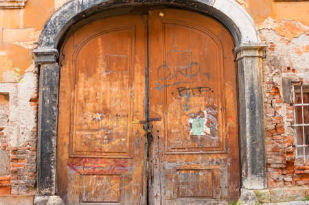 BRATISLAVA, SLOVAKIA - DECEMBER 16, 2016: Antique wooden door in old townのeditorial素材