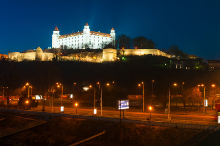BRATISLAVA, SLOVAKIA - DECEMBER 16, 2016: Medieval castle on a hill in duskのeditorial素材