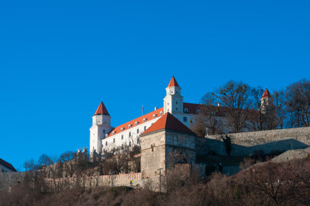 Medieval castle on a hill against blue sky, Bratislava, Slovakiaのeditorial素材