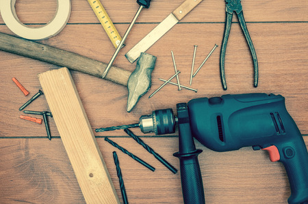 Working tools on wooden backgroundの写真素材