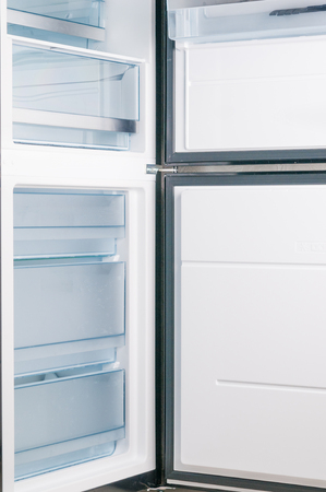 Empty fridge with open doorの写真素材