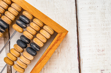 Old abacus closeup on wooden backgroundの写真素材