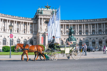 VIENNA, AUSTRIA - JUNE 07, 2017: Traditional old-fashioned fiacre at Heldenplatz near Hofburgのeditorial素材