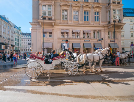 VIENNA, AUSTRIA - JUNE 05, 2017: Traditional old-fashioned fiacres at historical downtown のeditorial素材
