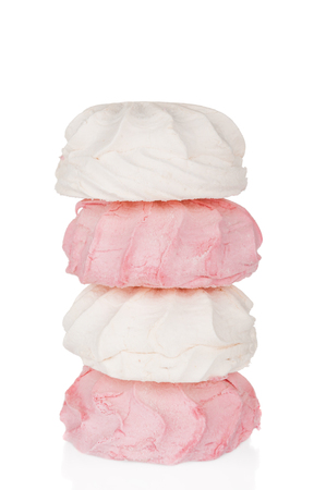 Pink and white marshmallows close up on white backgroundの写真素材