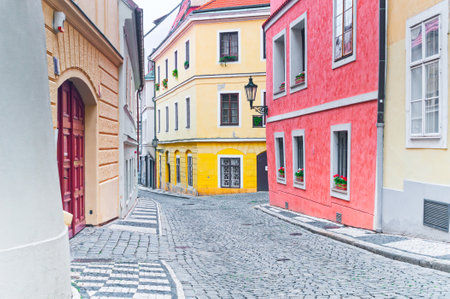 PRAGUE, CZECH REPUBLIC - JUNE 11, 2018: Empty narrow cobblestone street in downtownのeditorial素材