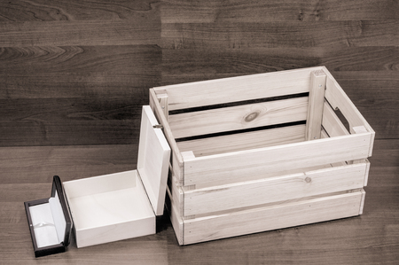 A few empty wooden boxes on brown floor backgroundの写真素材