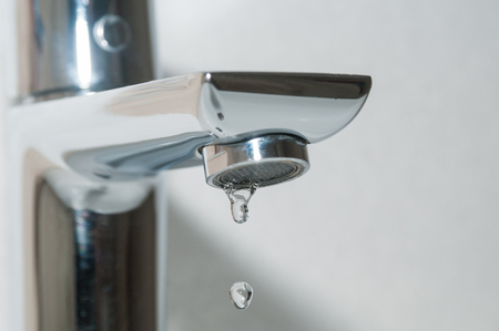 Bath faucet with water drops close upの写真素材