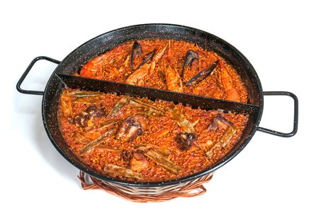 Paella in pan isolated on white backgroundの写真素材