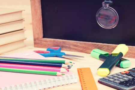 Back to school concept. School supplies on a desk