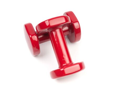 Two red dumbbells close up isolated on white backgroundの写真素材