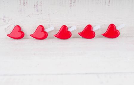Red hearts on wooden background. Valentines day card