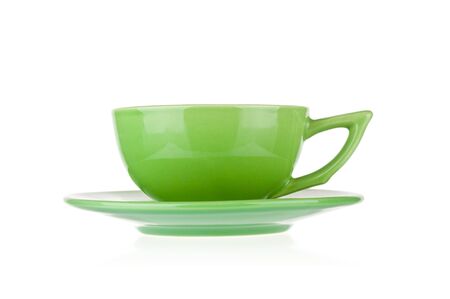 Green teacup with saucer isolated on white backgroundの写真素材