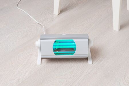 Ultraviolet irradiator on floor in living roomの写真素材
