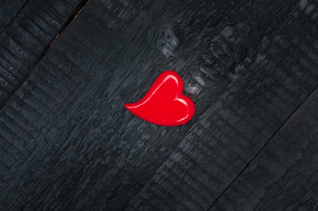 Heart on black wooden background. Valentines day cardの写真素材