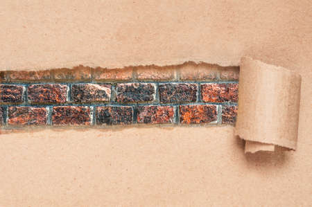 Brown torn paper with grunge brick copy space