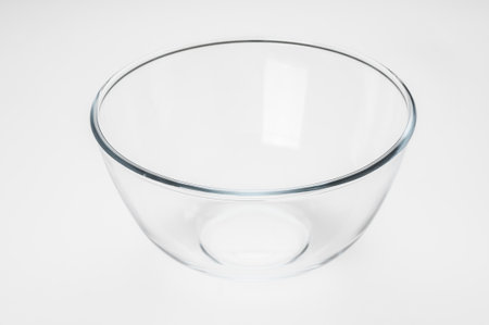 Empty glass food bowl on white backgroundの写真素材