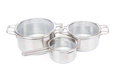 Steel saucepans with glass lids isolated on white backgroundの写真素材